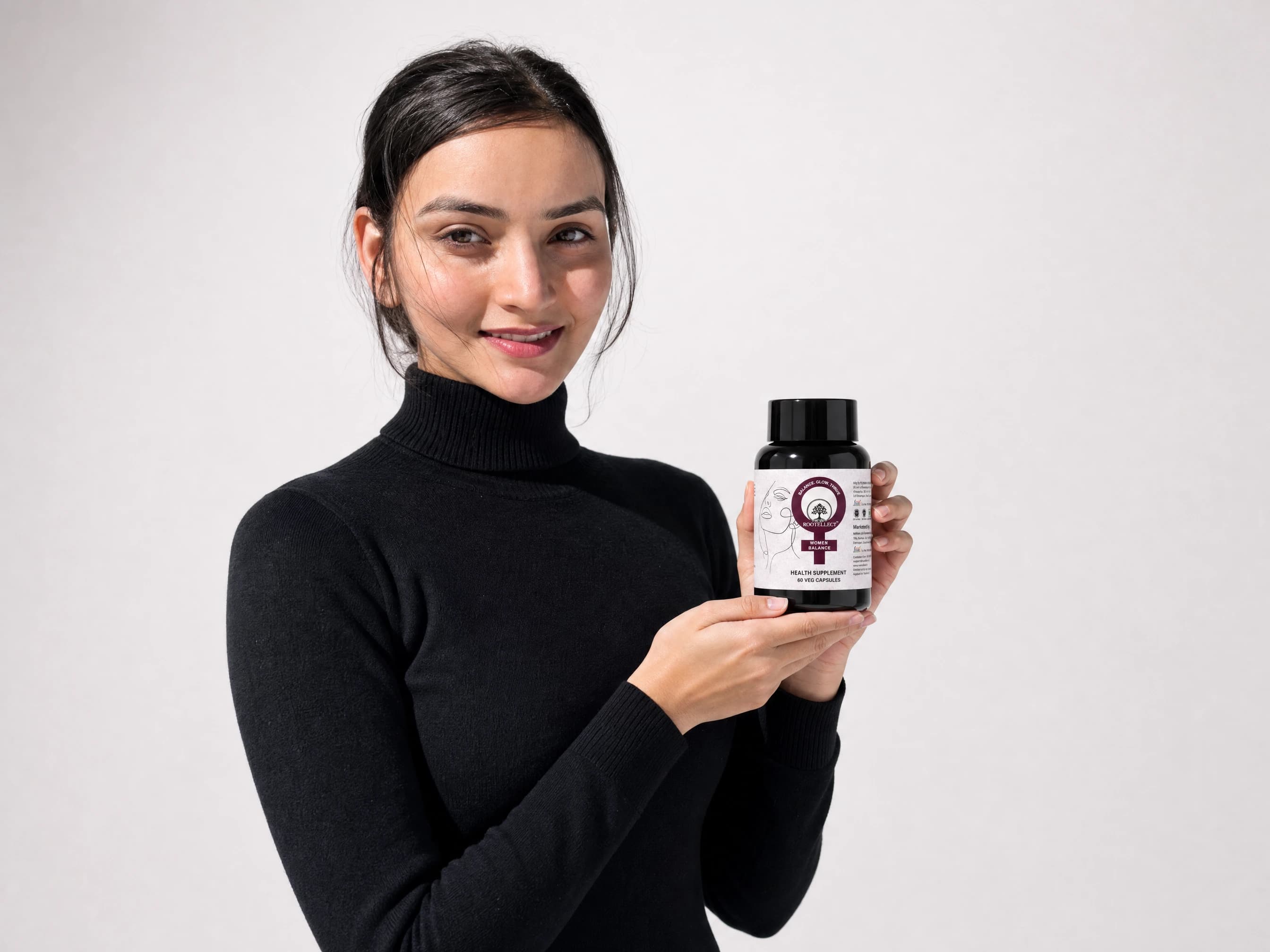 Woman holding a wellness supplement